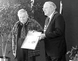 A well-known Mapua identity, Bill Marris, was one of several people to be presented with an award by the Tasman District Mayor, John Hurley, in the council chambers last month. 